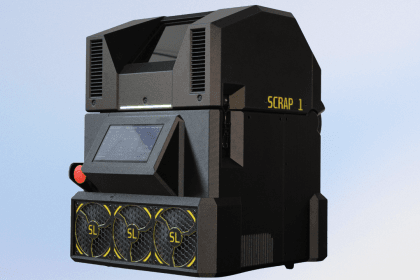 Impresora de impresión 3D metálica Scrap 1 sobre una mesa de trabajo